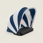 Blue and white striped baby seat with black base on a light gray background