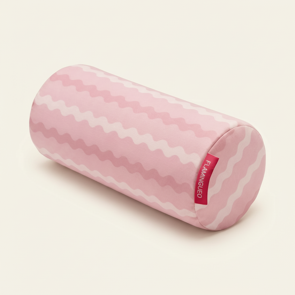 Pink cylindrical pillow with white pattern on a white background