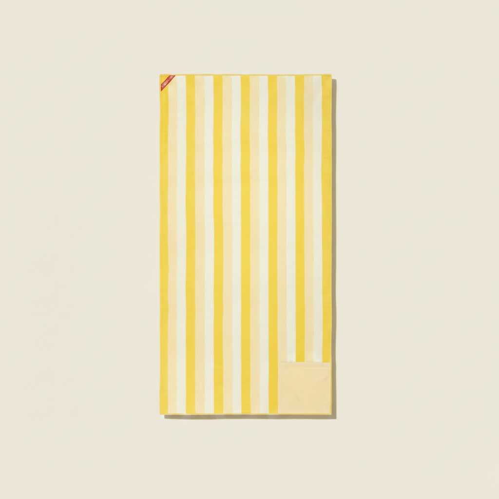 Yellow and white striped towel on a white background