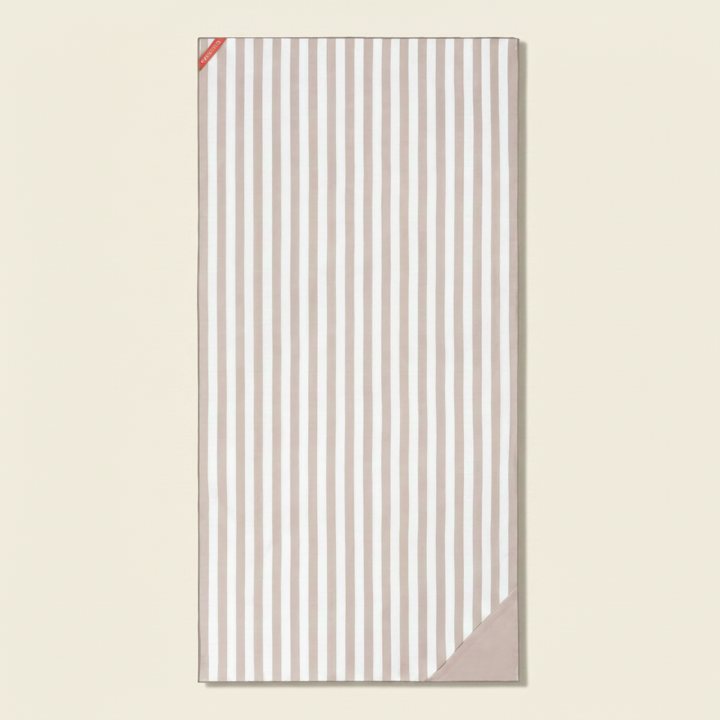 Striped towel with a pink border on a white background