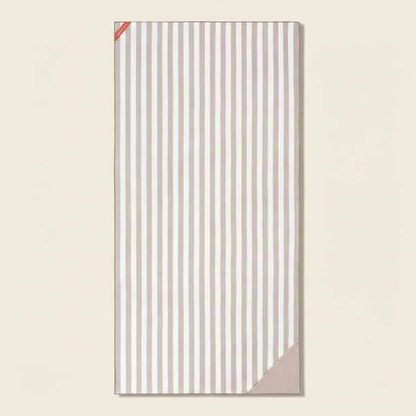 Striped towel with a pink border on a white background