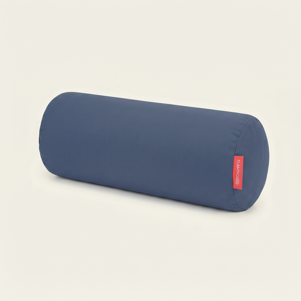 Blue cylindrical pillow with a red label on a light gray background