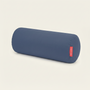 Blue cylindrical pillow with a red label on a light gray background